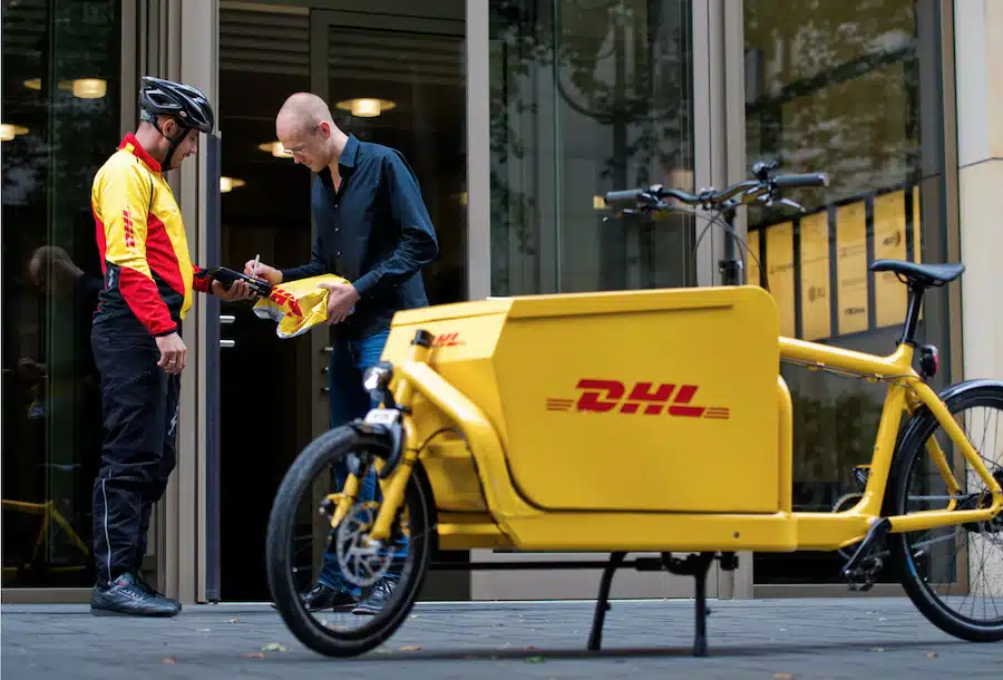Yellow DHL load bike parked during delivery
