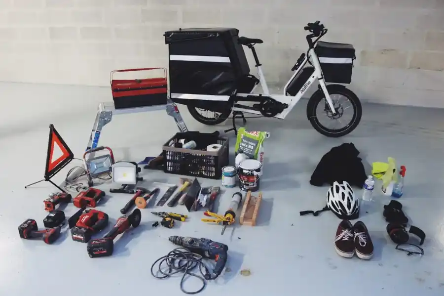 
Bike with cargo box capability shown by objects laid on the ground