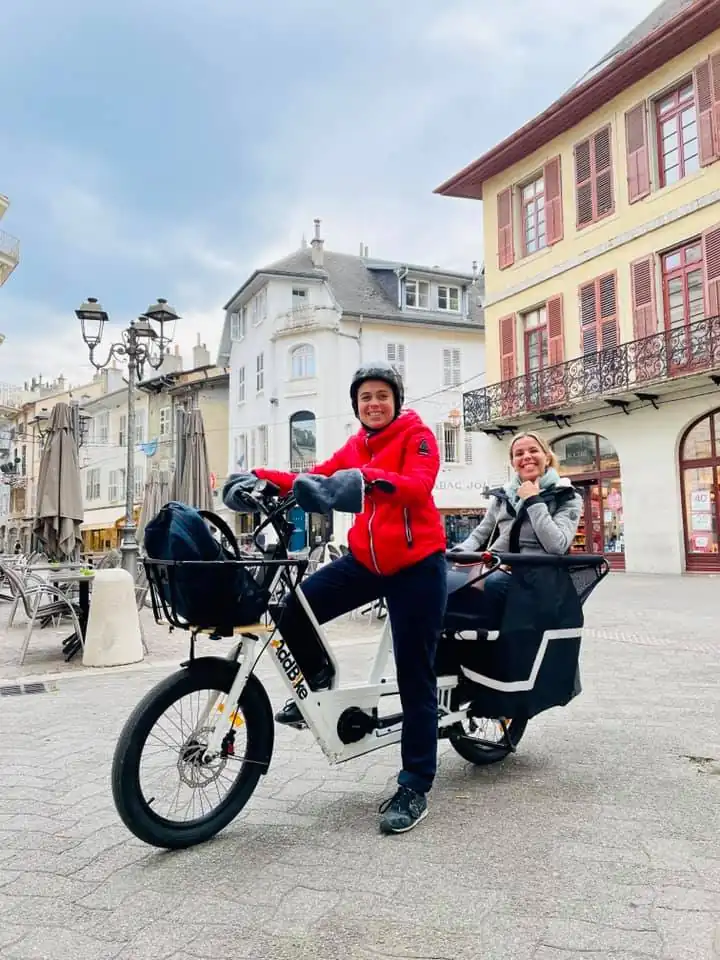 Cargo bike uk: two women riding the U-Cargo Family in winter 